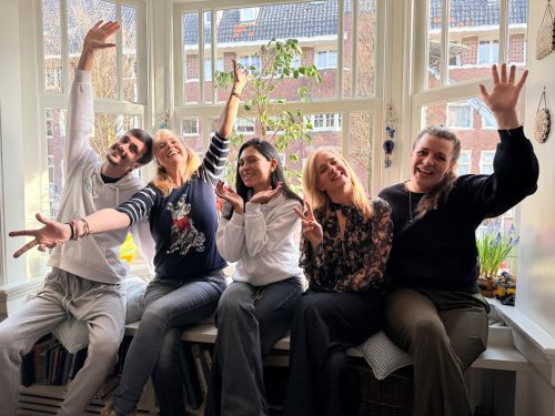 HomeVet veterinary team waving together